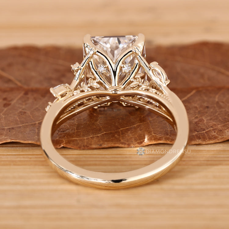 Marquise and round side stones on a radiant cut ring.
