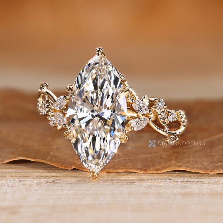 Marquise diamond ring with cluster and tulip setting.