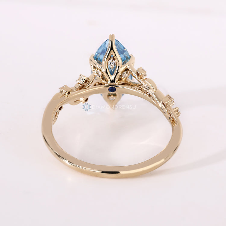 IGI certified blue centre diamond ring with tulip setting