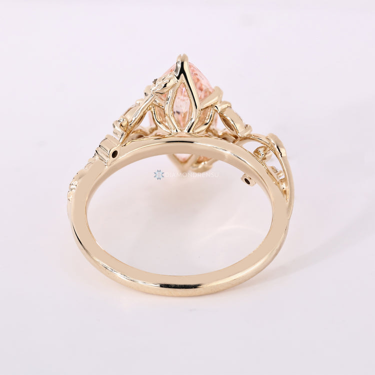 Handmade pink marquise diamond ring with side stones.
