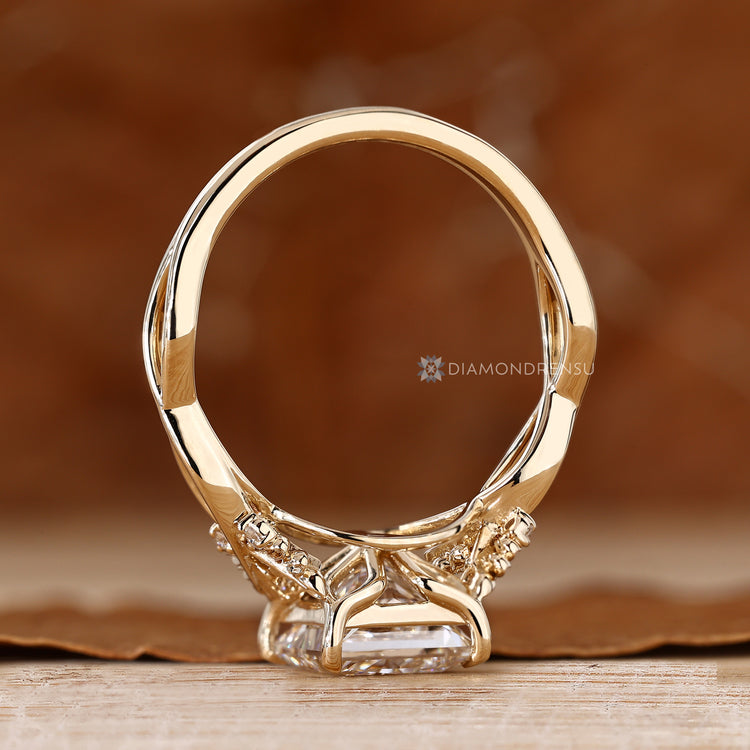 Princess cut diamond ring with four claw prong setting.