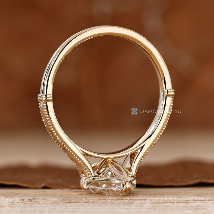 Marquise diamond ring with fishtail prong setting.