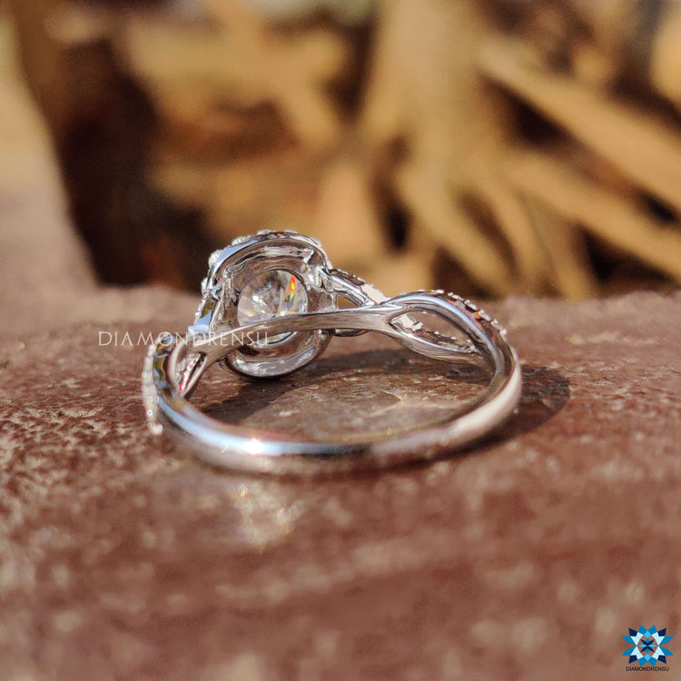 Custom engagement ring with round moissanite and pave band.
