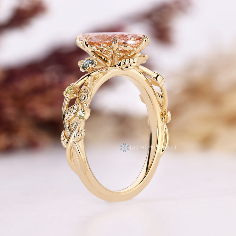 Marquise diamond ring with six leaf style prongs.