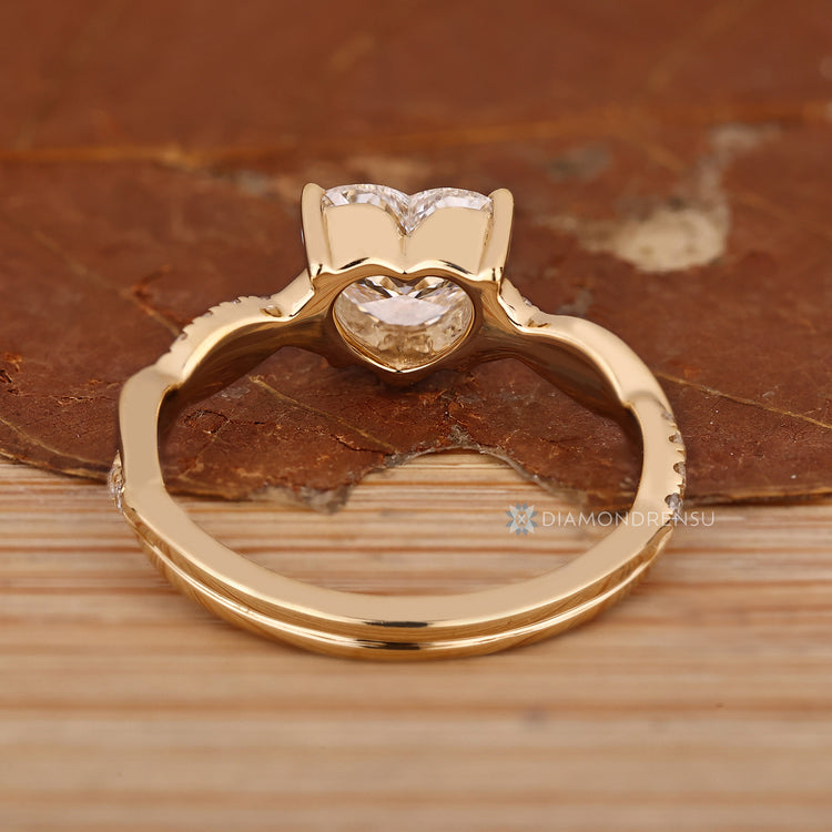 Heart cut diamond ring with v shape prong setting.