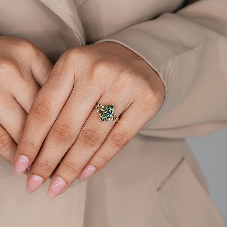 Nature inspired ring with marquise centre diamond.