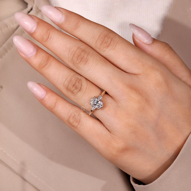 Lab grown oval diamond ring with four prong setting.
