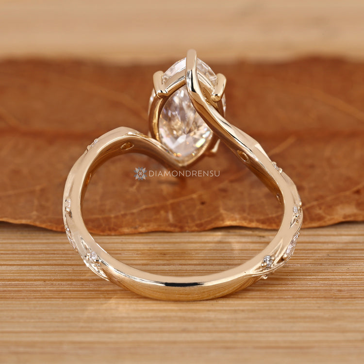 Marquise cut diamond ring with six claw prong setting.