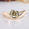 Solitaire engagement ring with yellow cushion OMC cut diamond.