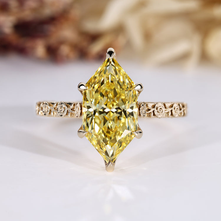 Nature inspired engagement ring with yellow Dutch marquise diamond.