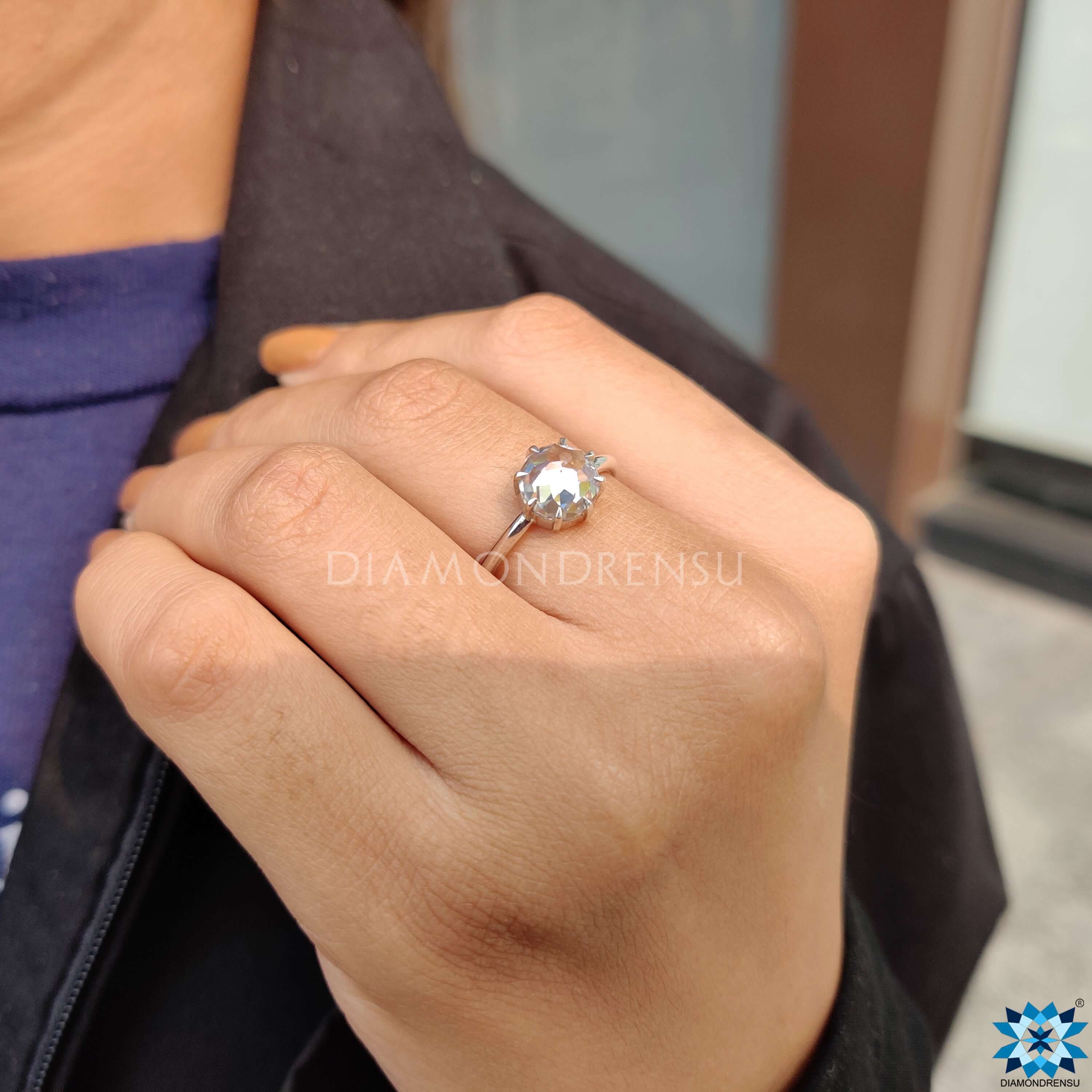 Shop to buy engagement ring featuring a classic round cut moissanite ring.