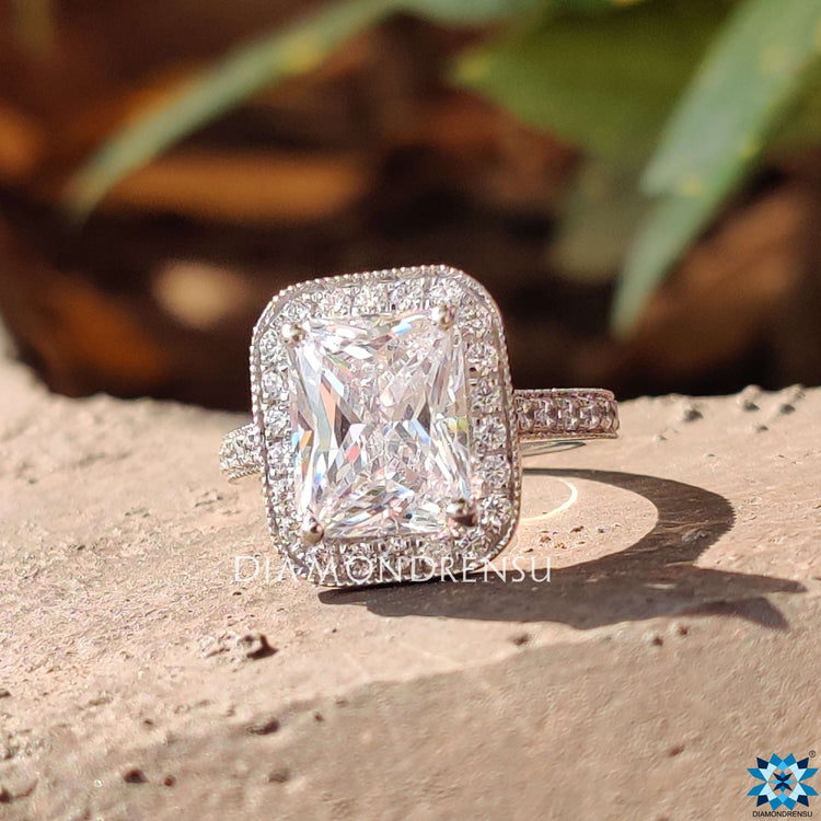 Handmade moissanite ring with pavé accents.

