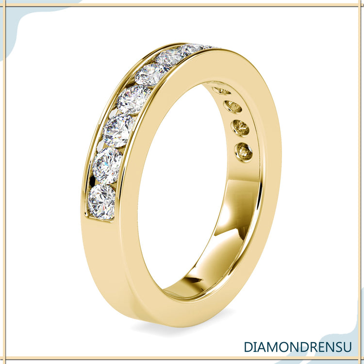 White gold wedding band with channel set round diamonds.
