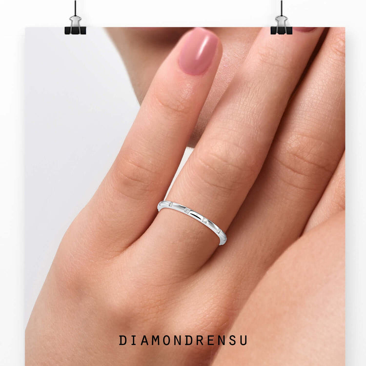 Round cut diamond eternity wedding band in white gold.
