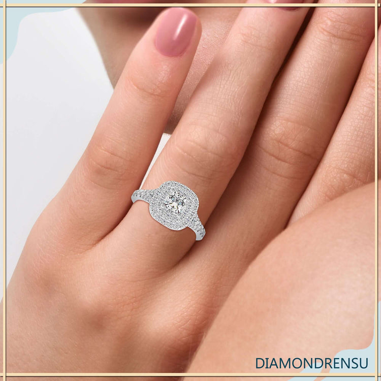 Cushion cut diamond ring featuring split shank pave band in rose gold.
