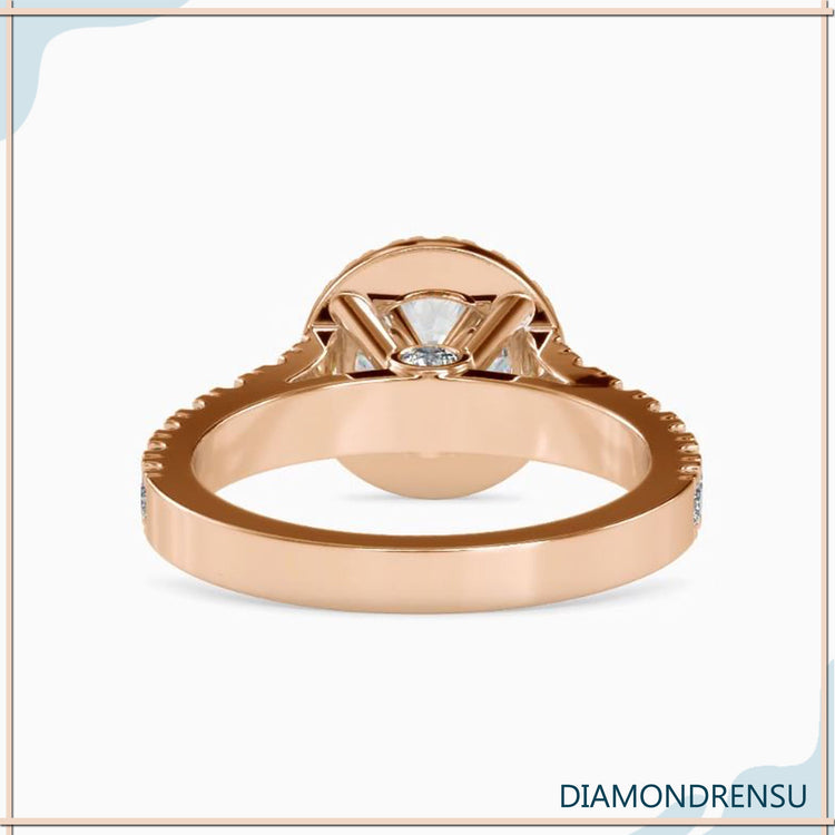 Round cut halo with 4 prong setting in custom design.
