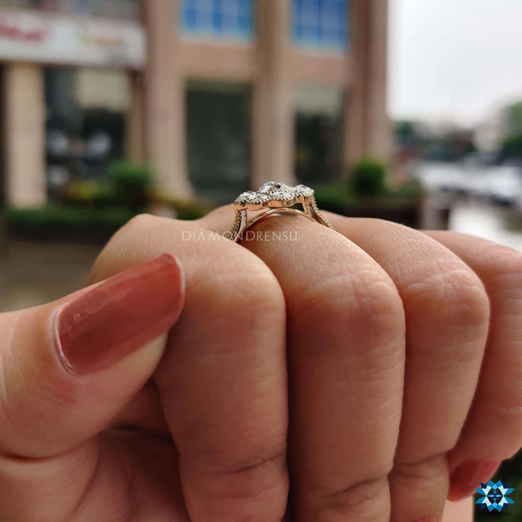 Moissanite halo ring with detailed milgrain setting.
