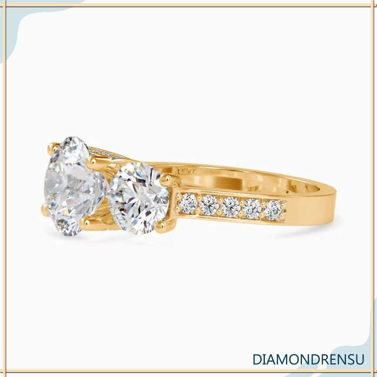 Diamondrensu UK ring with round diamond and pave detail.
