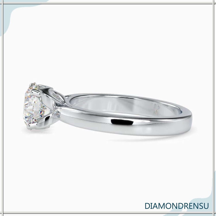 Buy engagement ring in UK with handmade round diamond setting.
