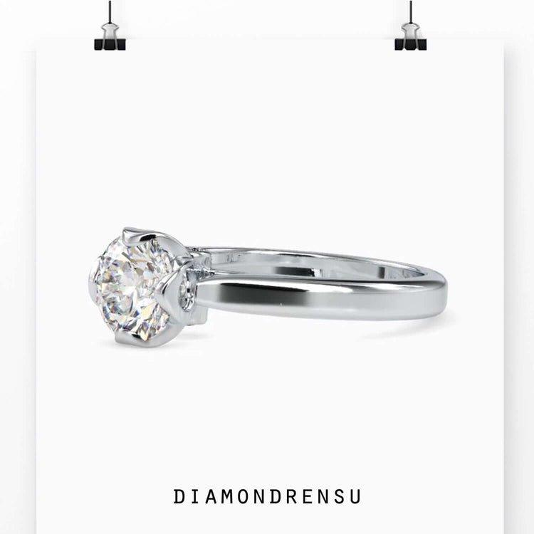 Cathedral setting ring in white gold with solitaire diamond centre.
