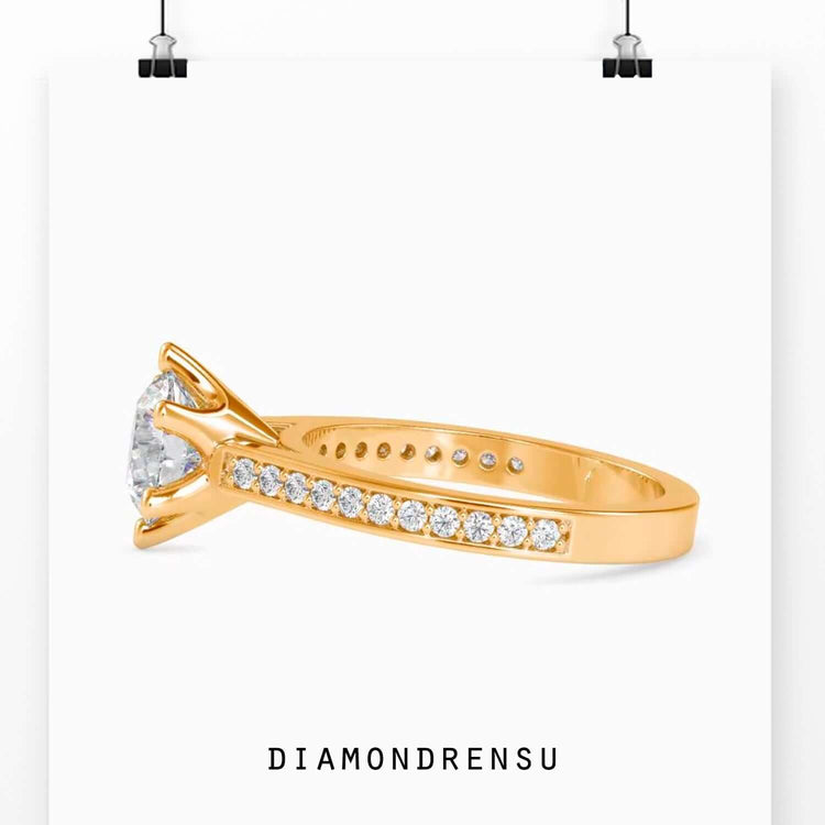 Round cut diamond ring in rose gold with custom engagement style.
