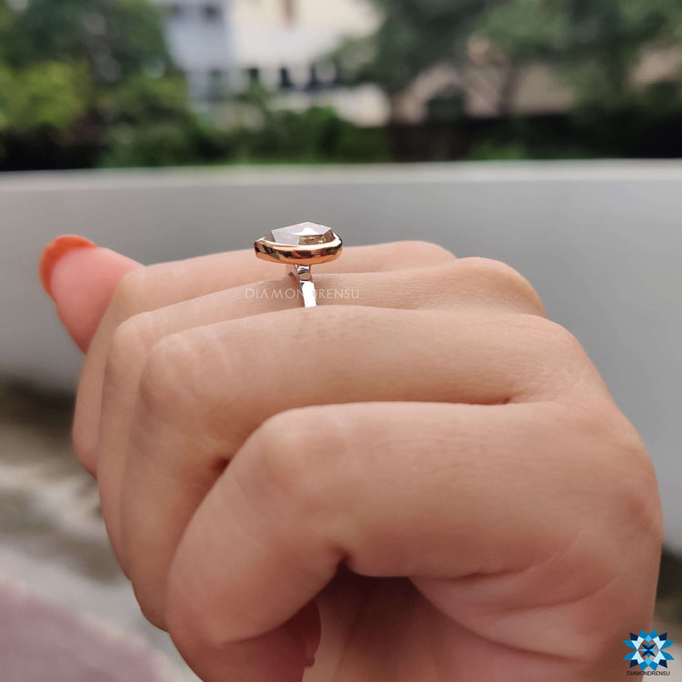Handmade rose gold and white gold pear shaped engagement ring.
