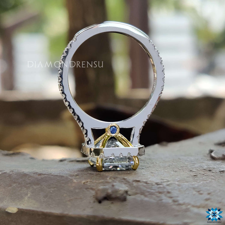 Radiant cut gray moissanite ring with 4 prong setting.
