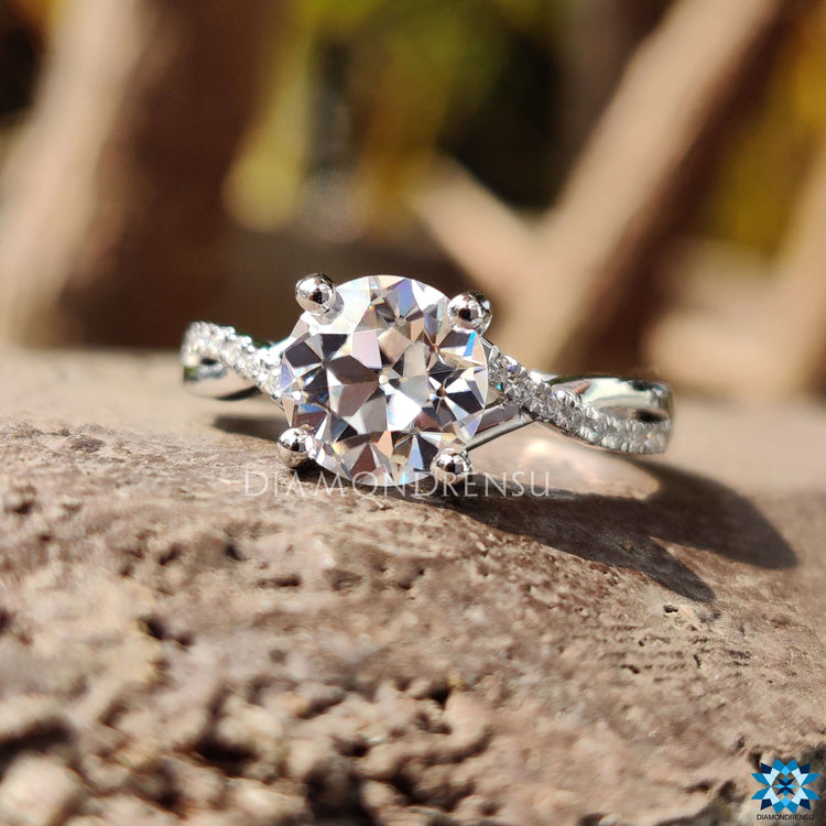 Custom engagement ring with twisted pave moissanite band.
