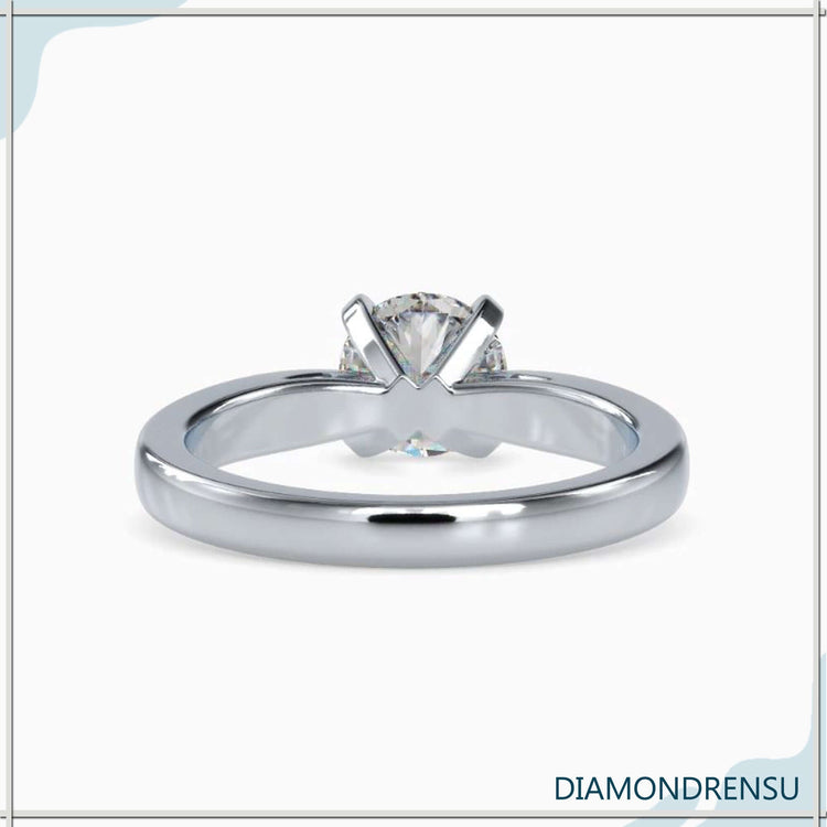 Handmade ring with solitaire round brilliant diamond centre.
