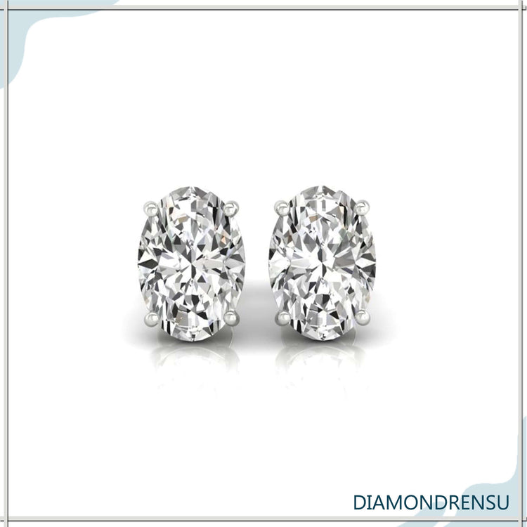 Lab grown diamond earrings with oval cut stones in white gold studs.
