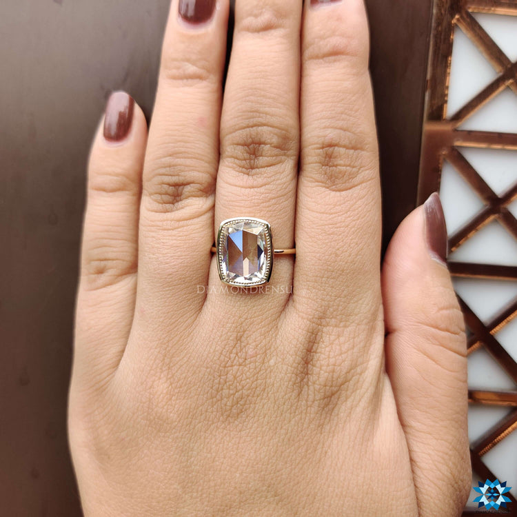 Handmade moissanite ring with vintage milgrain detail.
