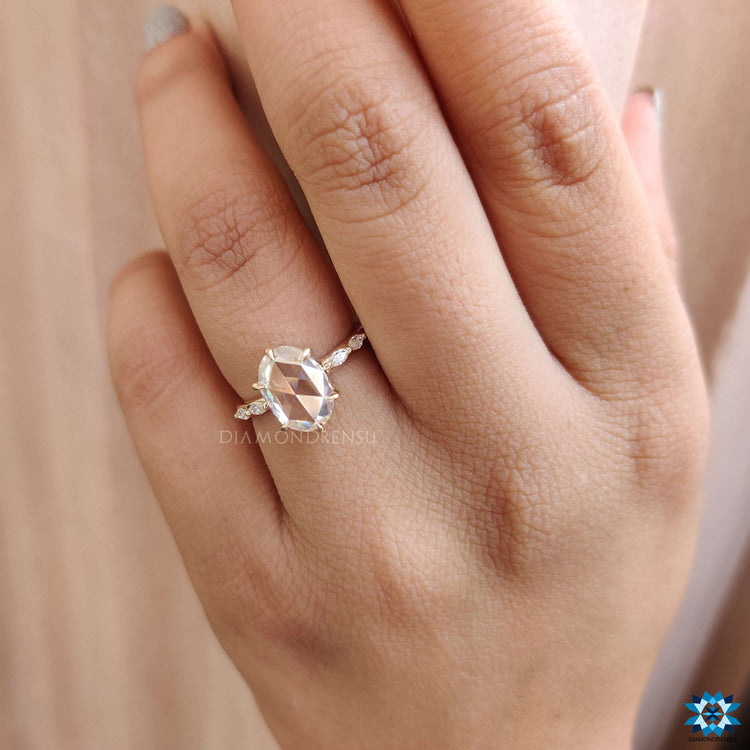 Custom moissanite ring featuring marquise and pave details.
