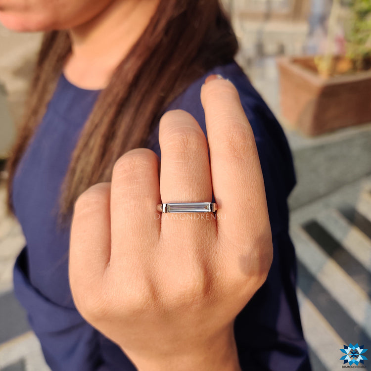 Custom engagement ring with baguette cut moissanite.
