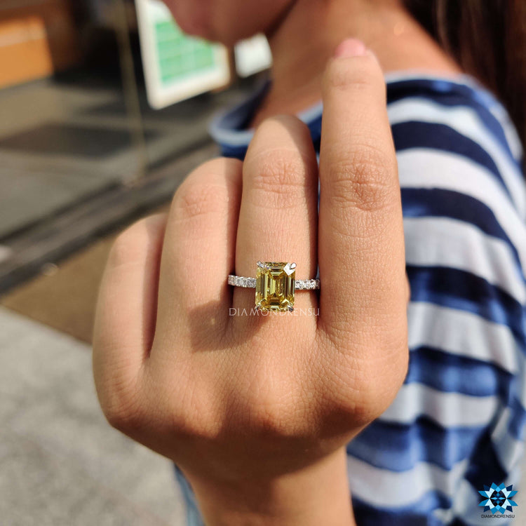 White gold engagement ring featuring canary yellow moissanite.
