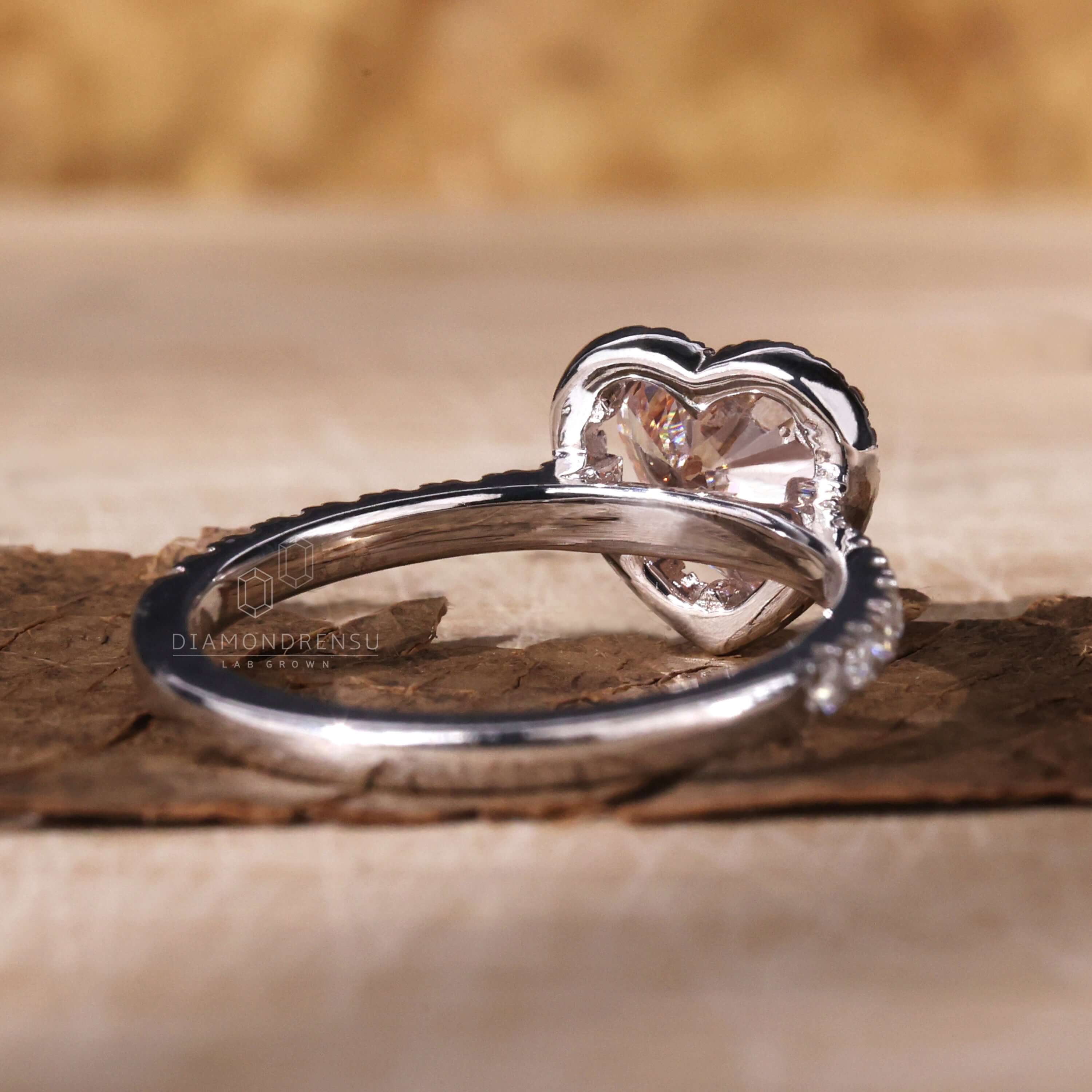 Heart shaped ring paired with a claw prong engagement ring design
