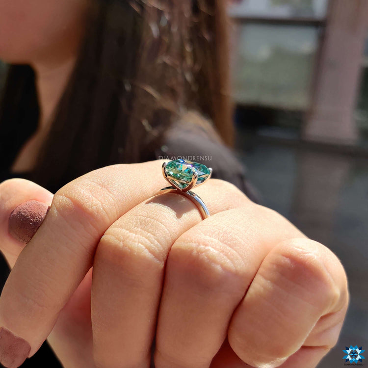 Custom engagement ring in solitaire cushion cut.
