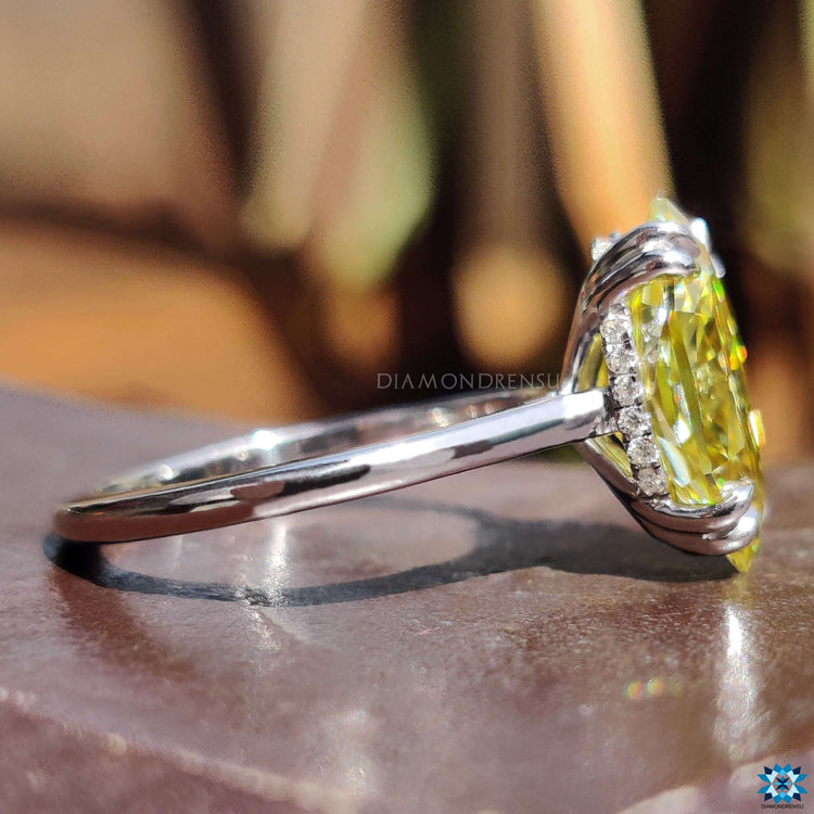 Hidden halo moissanite ring with round cut accents.
