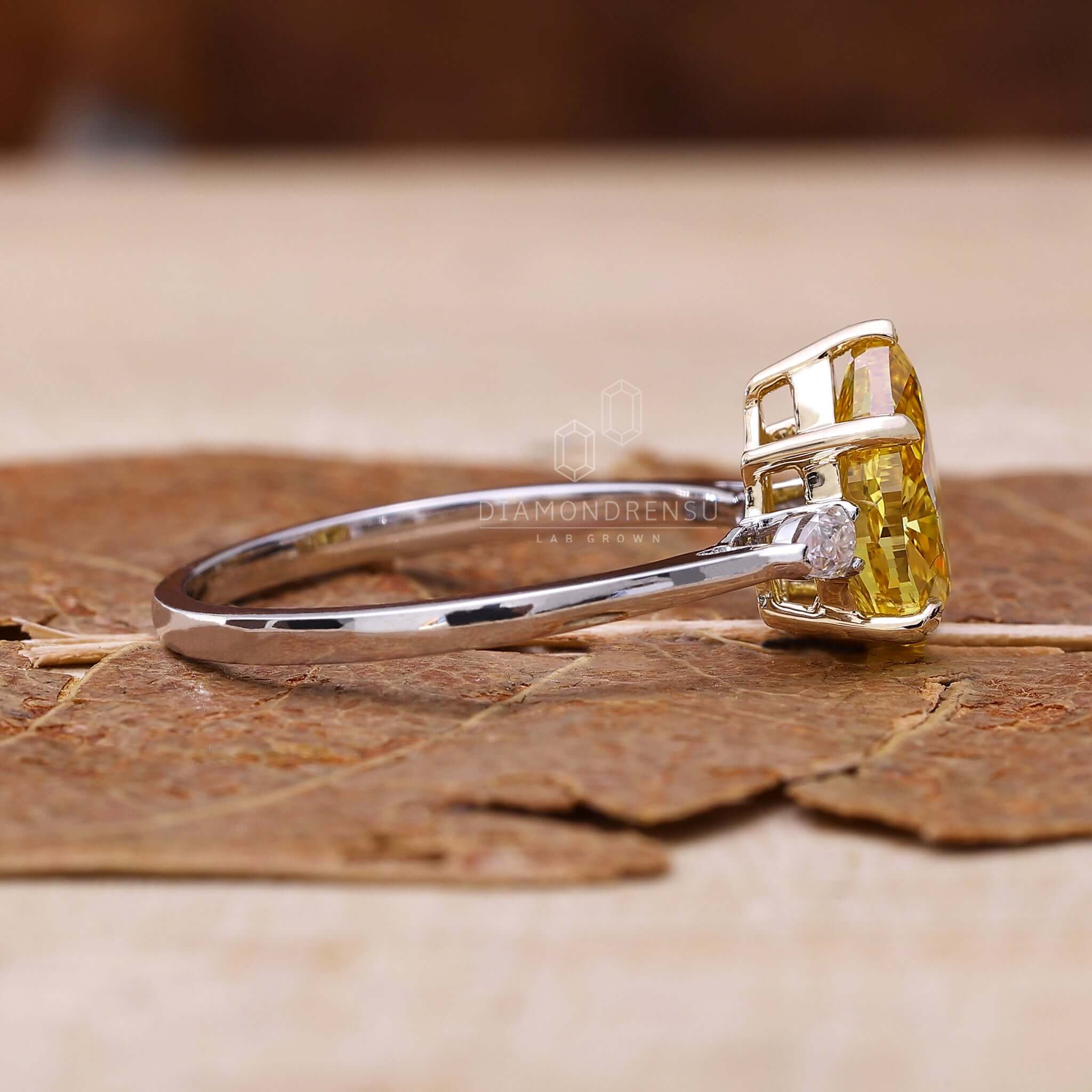 Pear shape yellow diamond ring exudes luxury and charm.