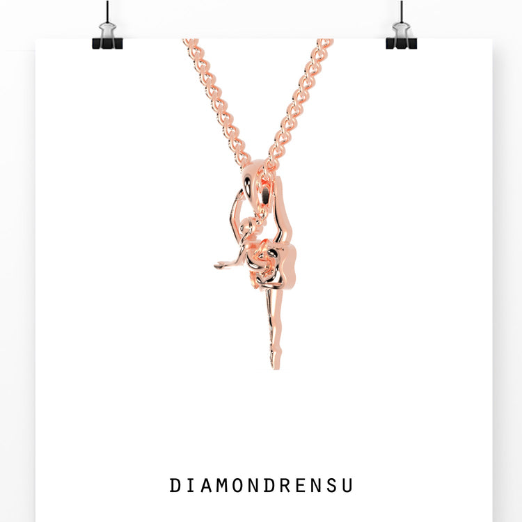 Rose gold pendant with dancing angel silhouette.
