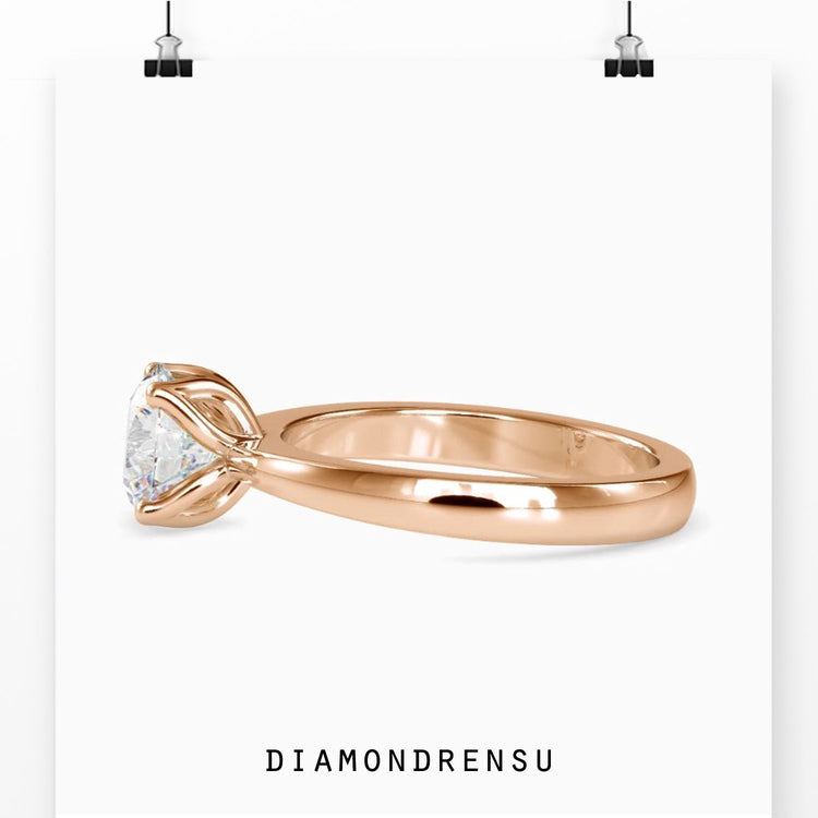 Yellow gold diamond ring with handmade solitaire band.
