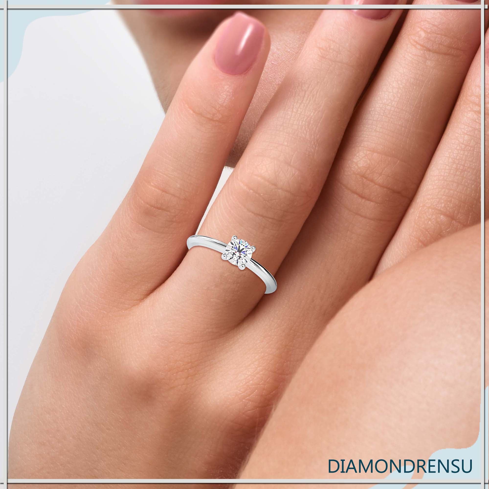 Timeless diamond emerald cut solitaire ring set in white gold.