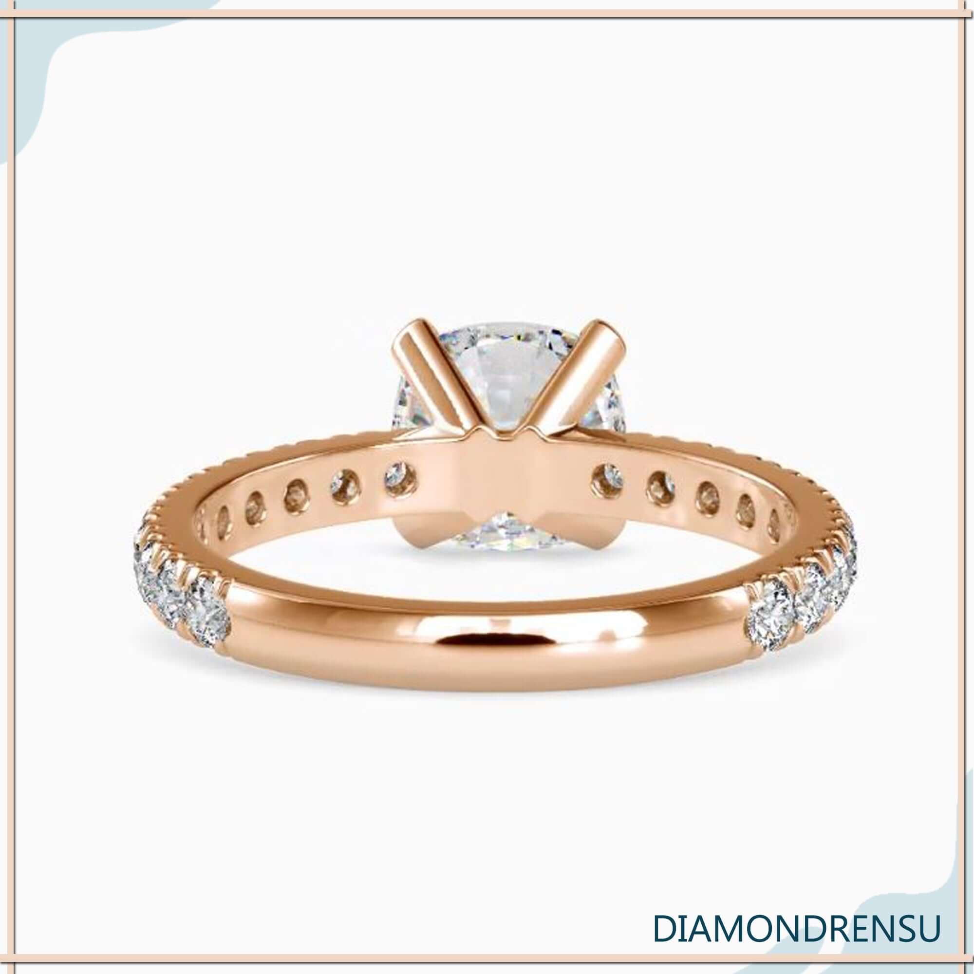 Engagement ring with pave featuring a 2 carat cushion cut diamond, claw prong ring design.
