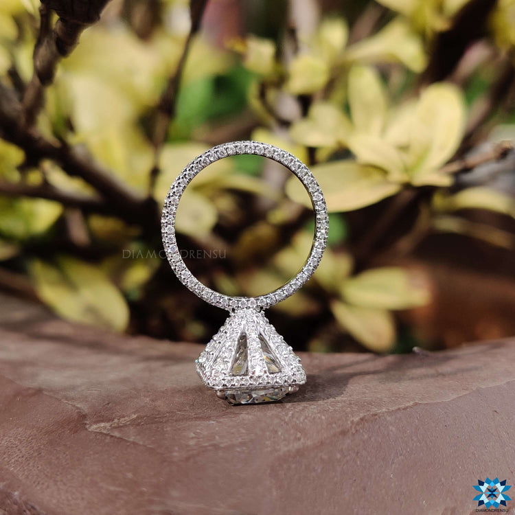 Prong setting on white gold cushion moissanite ring.
