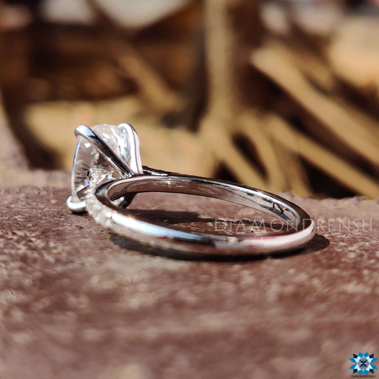 Custom engagement ring with Cushion Divine moissanite and tab prong mount.

