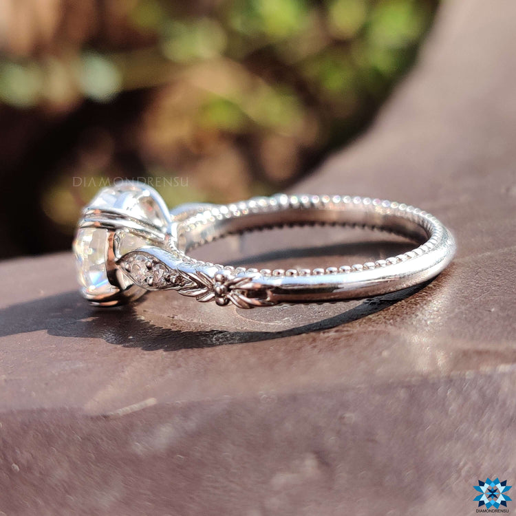 Double claw prong ring with vintage milgrain accents in white gold.
