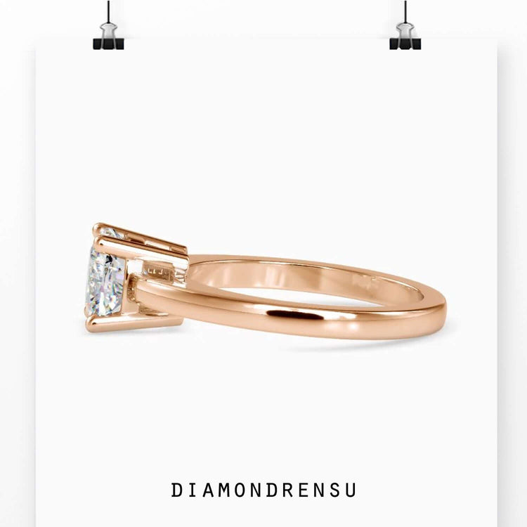 Rose gold ring showcasing a cushion diamond solitaire ring with elegant craftsmanship.
