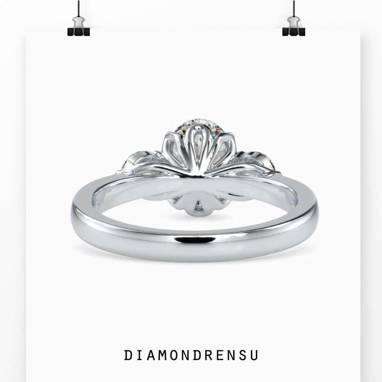 IGI certified oval diamond with round side stones.
