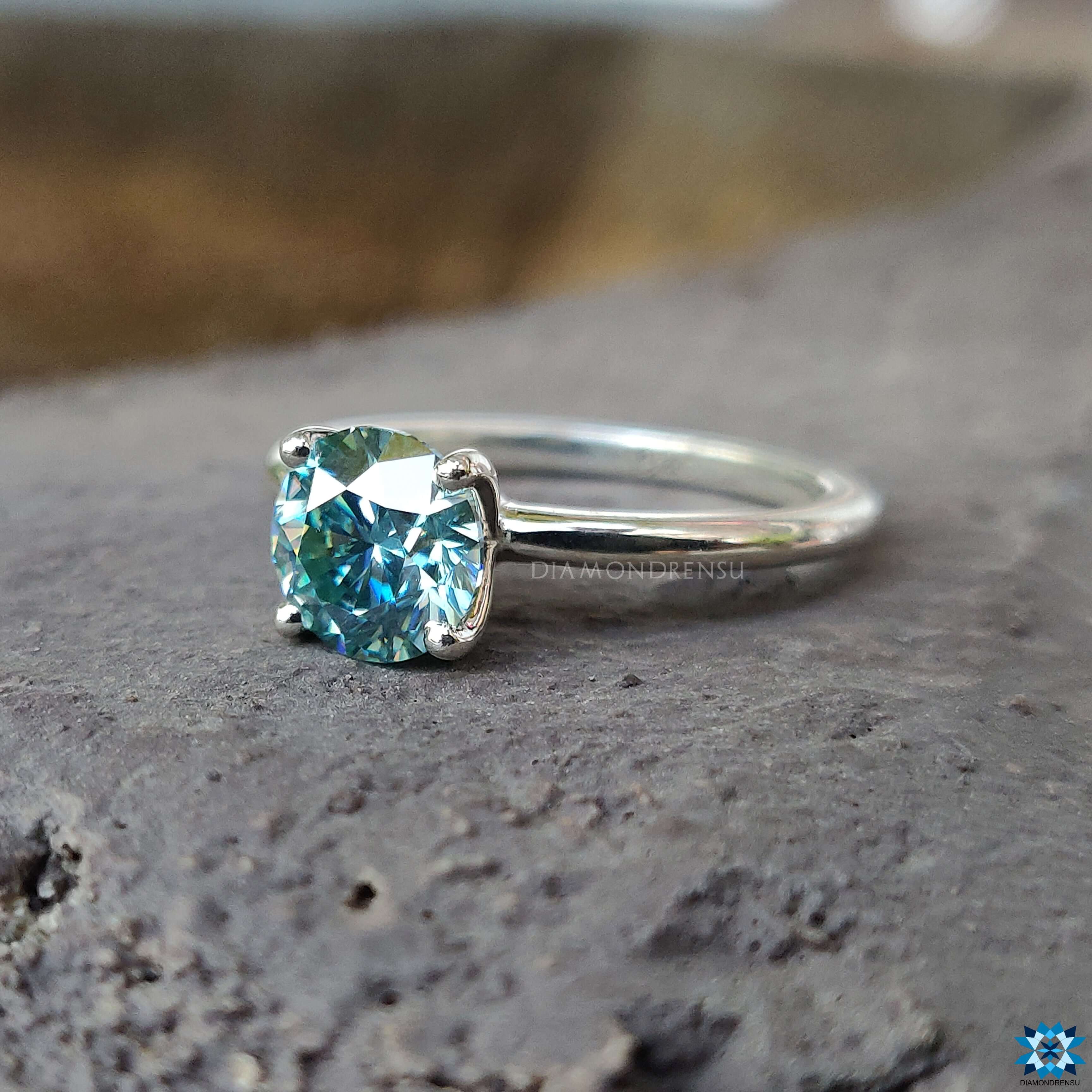 Elegant solitaire moissanite ring featuring a sleek 4 prong setting for a secure and stylish engagement.
