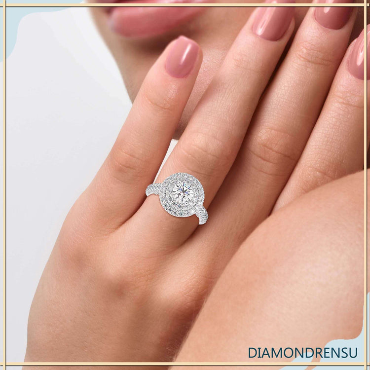 Double halo ring with round cut diamond and pave band.
