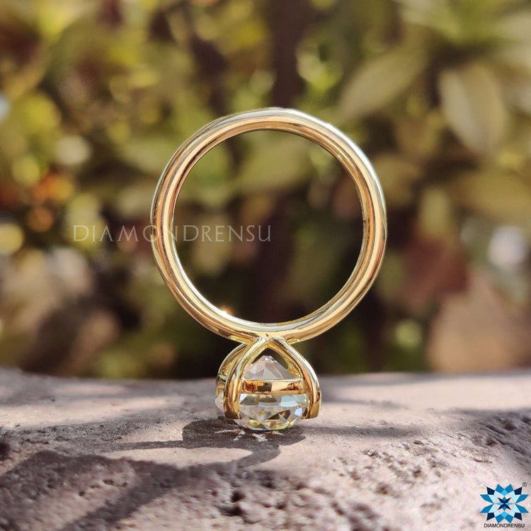 Prong setting ring with Old European cut moissanite.
